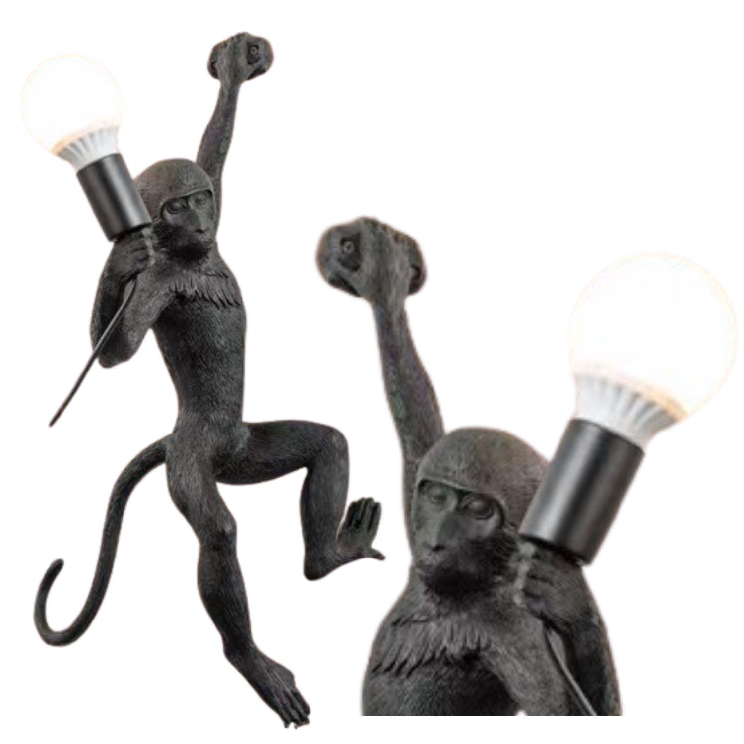 Stylowa lampa ścienna - małpka (lewa łapka)