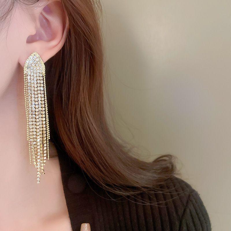 Long earrings flowing pebbles - gold