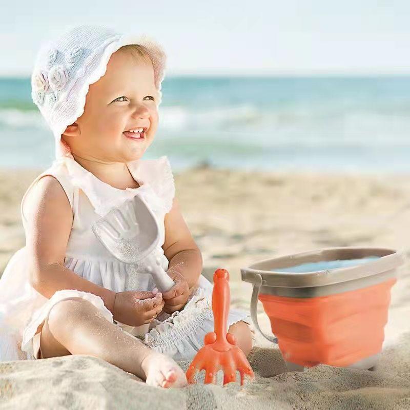 Collapsible silicone sand bucket with shovel and rakes