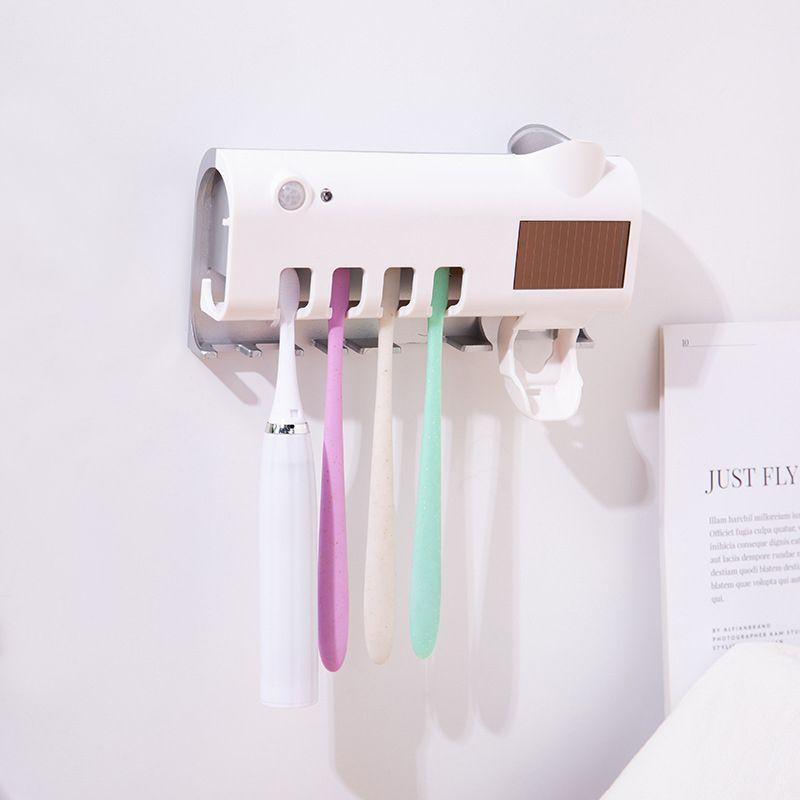 UV toothbrush holder with a paste dispenser - white