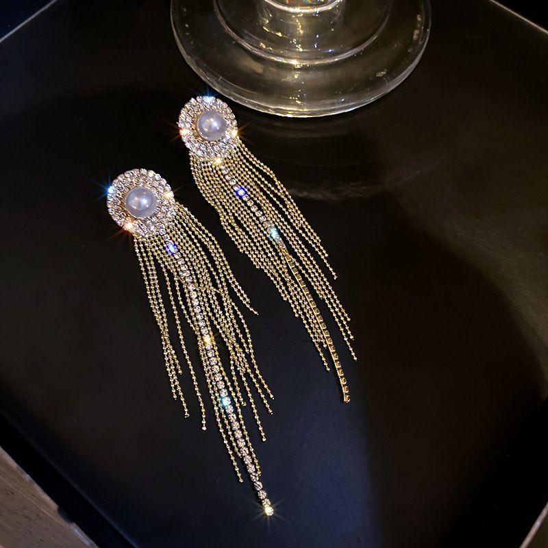 Long earrings hanging strands of crystals - gold