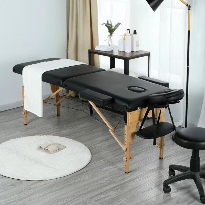 Folding massage bed - black