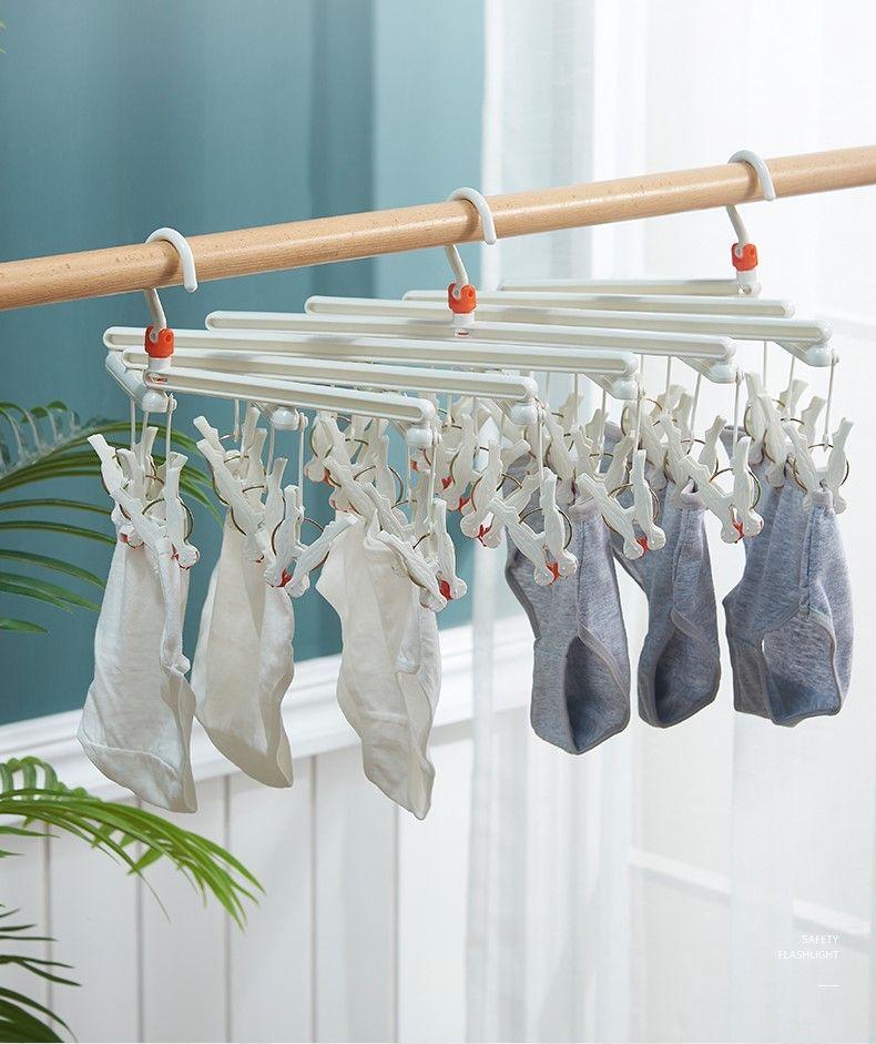 Plastic foldable clothes hanger with clips - 14 clips - white