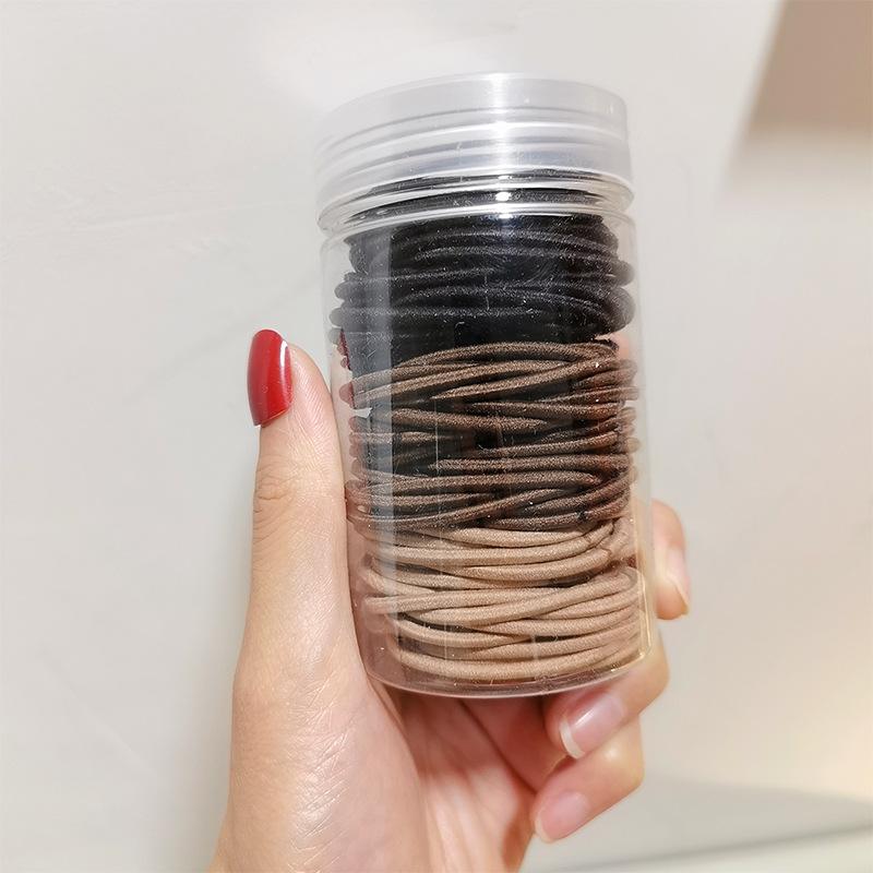 A set of hair elastics - brown