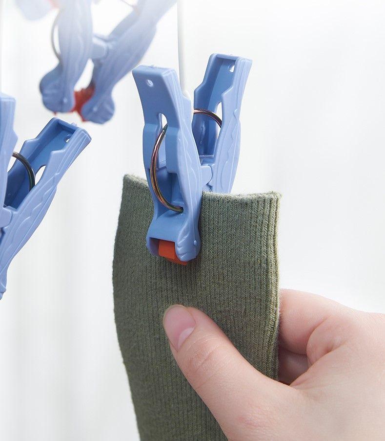 Plastic foldable clothes hanger with clips - 29 clips - light blue