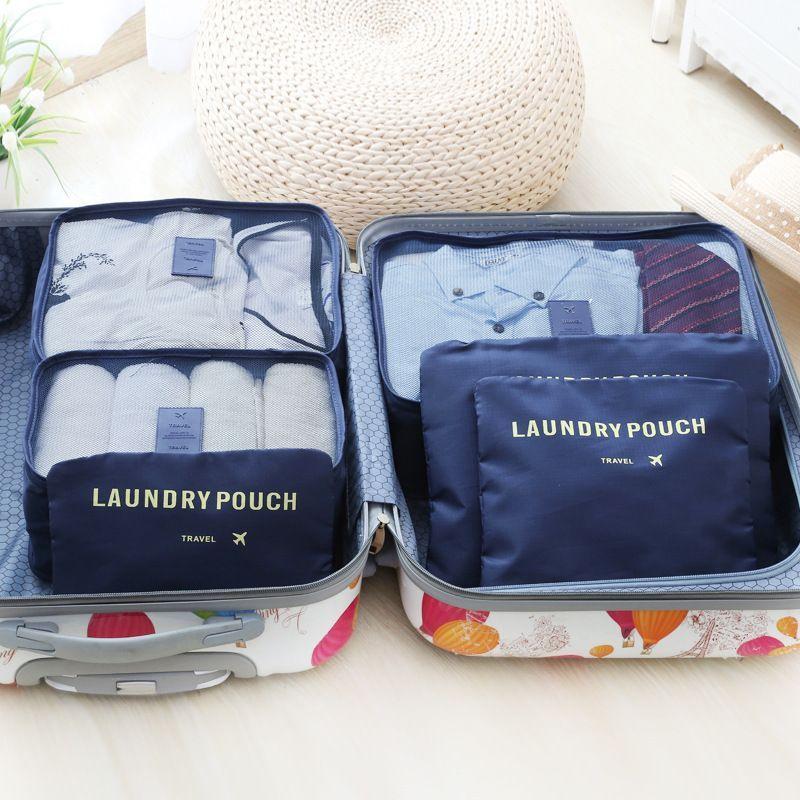 A set of travel organizers for a suitcase and a wardrobe (6 pcs) - dark blue